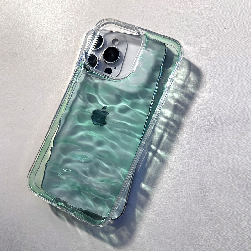 A clear, deep cyan water ripple textured phone case on an iPhone, showcasing a premium aesthetic design.