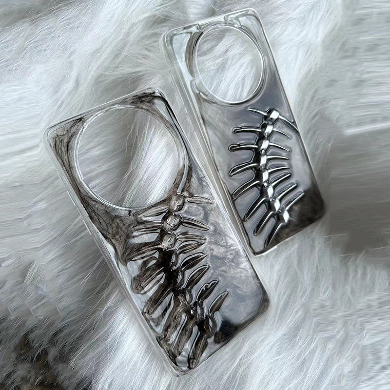 A clear phone case featuring a 3D metallic fish bone design held by a hand.