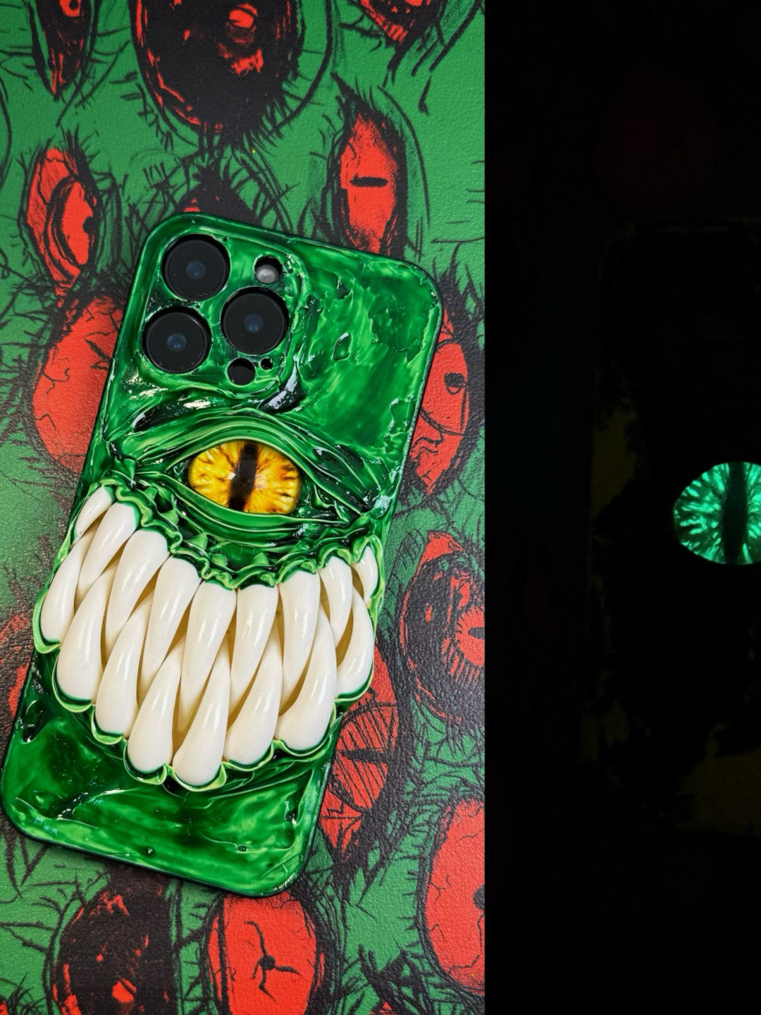 3D horror-themed iPhone case featuring a realistic monster eye and sharp teeth with a glowing effect in the dark.