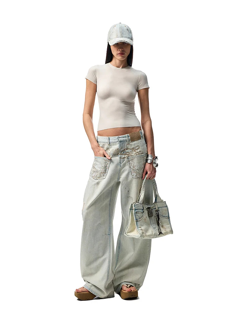 Distressed Arc-Leg Jeans
