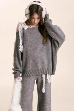 A romantic matching wool knit set with delicate lace trim details.