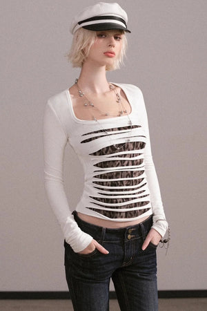 A white long-sleeve top with a unique ripped design and square neckline.