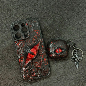 A white 3D textured AirPods case featuring a realistic glowing blue eye design with a star charm.