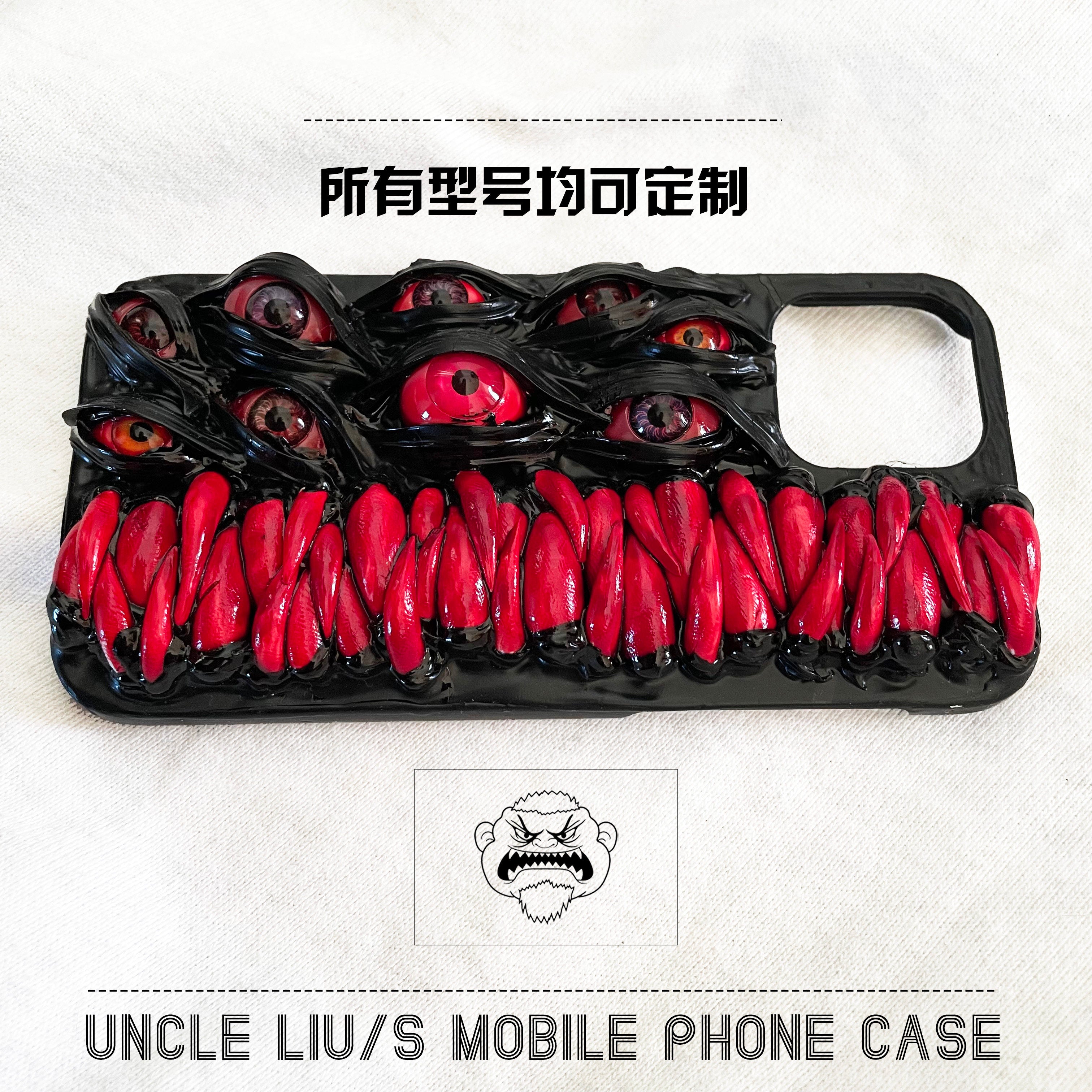 Handmade 3D horror-themed iPhone case featuring multiple realistic eyes and red textured details on a black background.