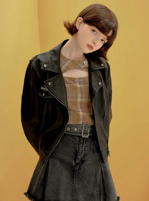 A short black leather jacket with a vintage American style.