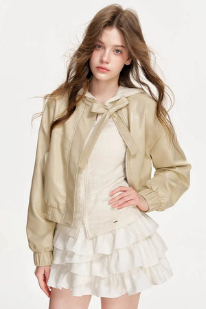 A light apricot eco-friendly leather jacket with a bowknot detail.