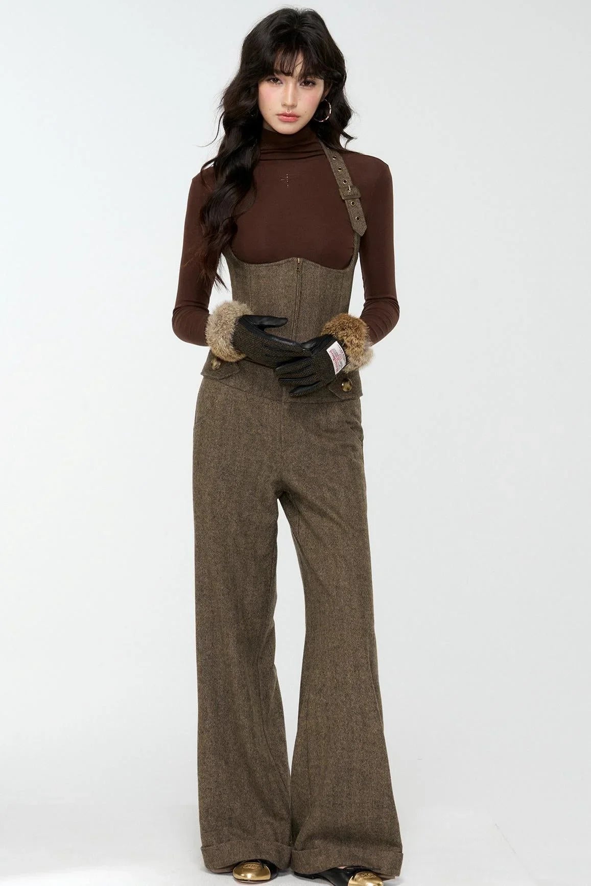 A model wearing an elegant woolen tweed vest and matching pants set.