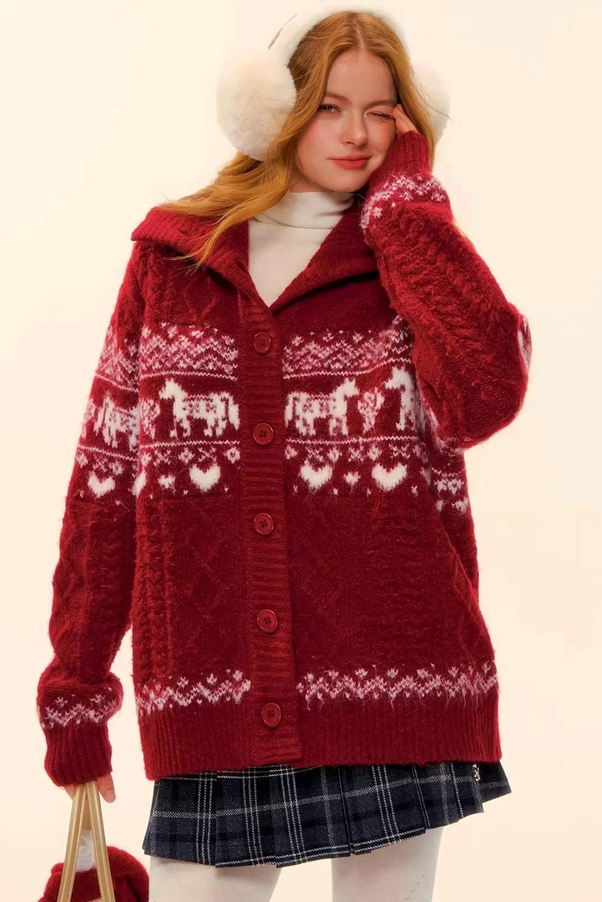 A model wearing a red Fair Isle wool cardigan.