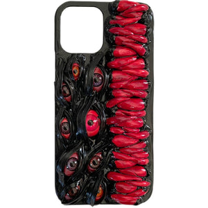 Handmade 3D horror-themed iPhone case featuring multiple realistic eyes and red textured details on a black background.