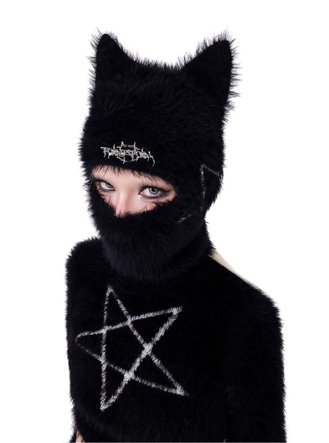 Black knit hat with cat ears and metal detailing.