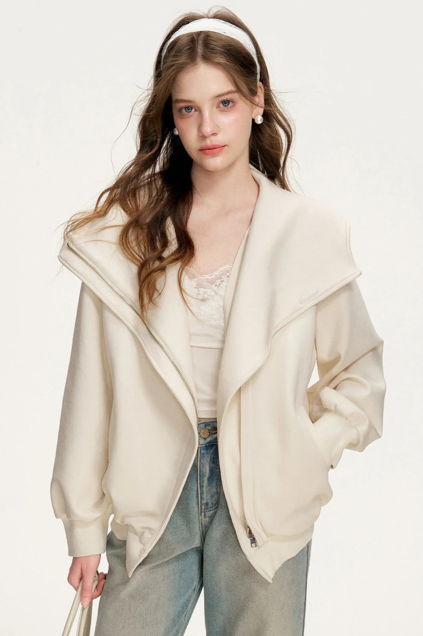 A light apricot hooded double-zip jacket.