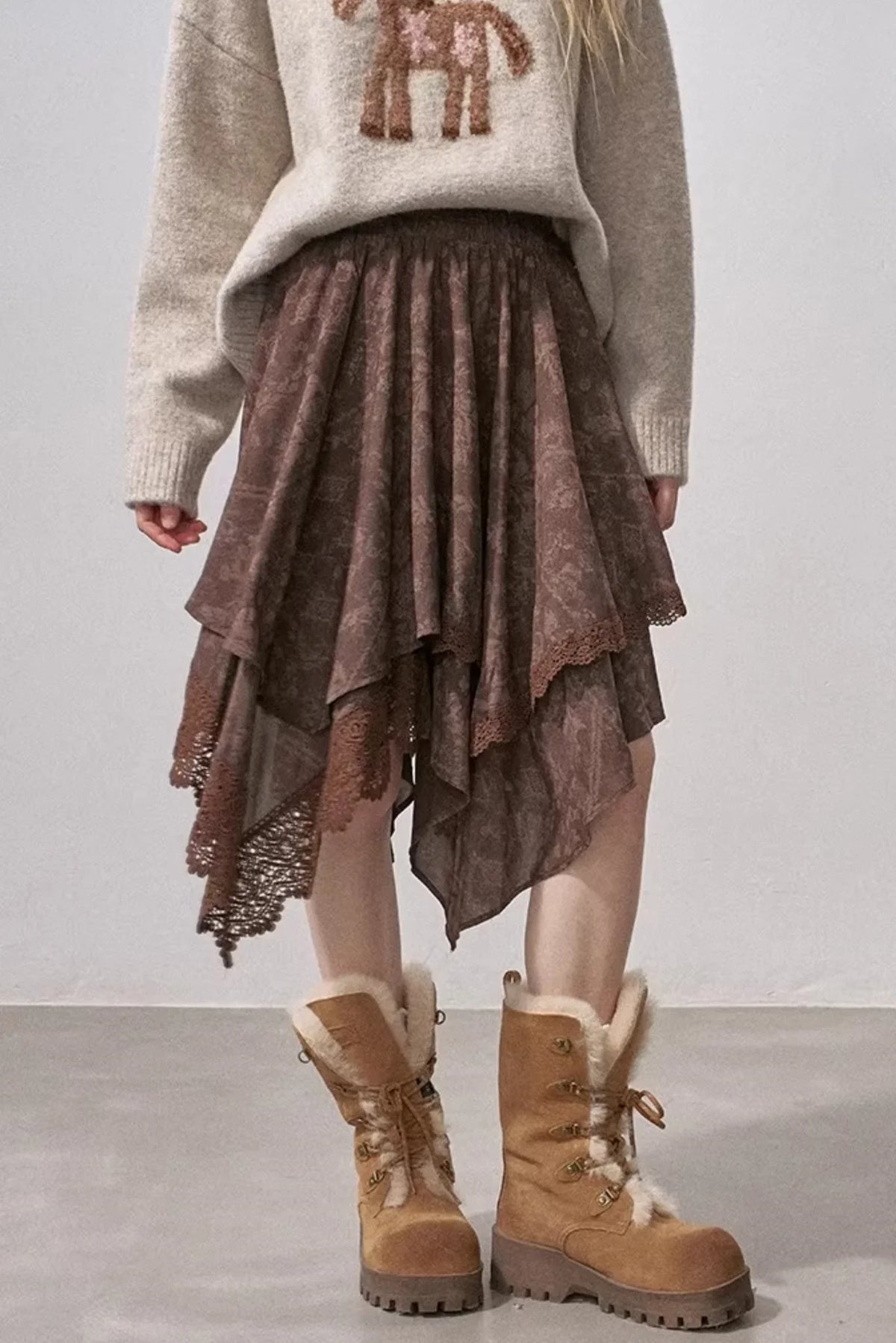 A brown lace asymmetrical layered skirt.