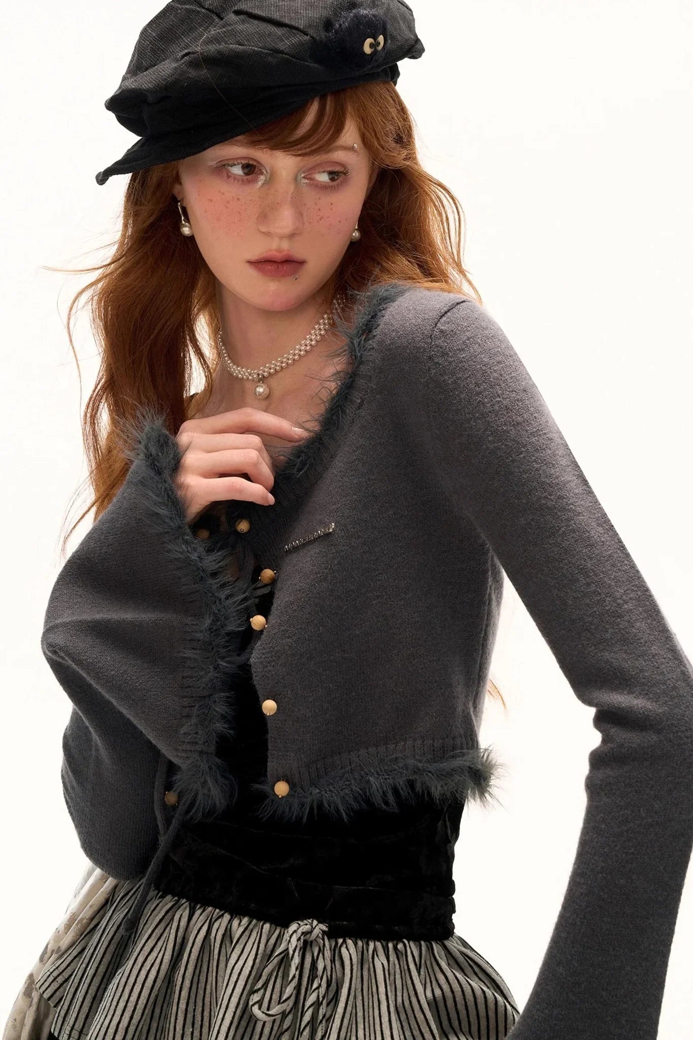 A stylish gray wool sweater with a scoop neck, perfect for a cozy autumn look.