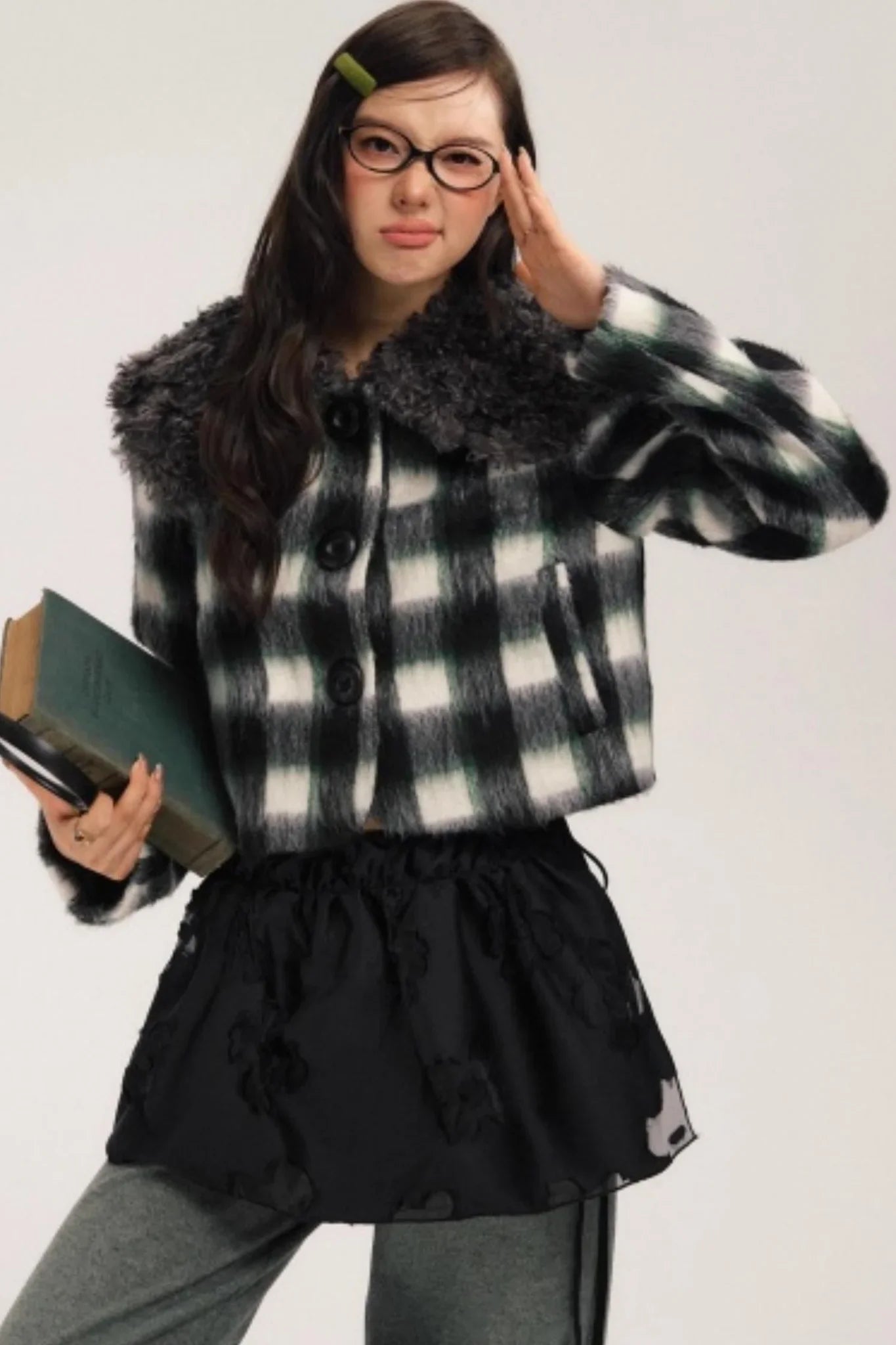 A gray and green plaid wool jacket with a dark faux-fur collar.
