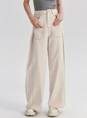 A pair of high-waisted wide-leg cotton pants in white.
