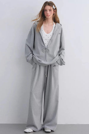 A comfortable gray hooded sweatshirt and matching pants set.