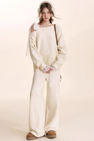 A romantic matching wool knit set with delicate lace trim details.