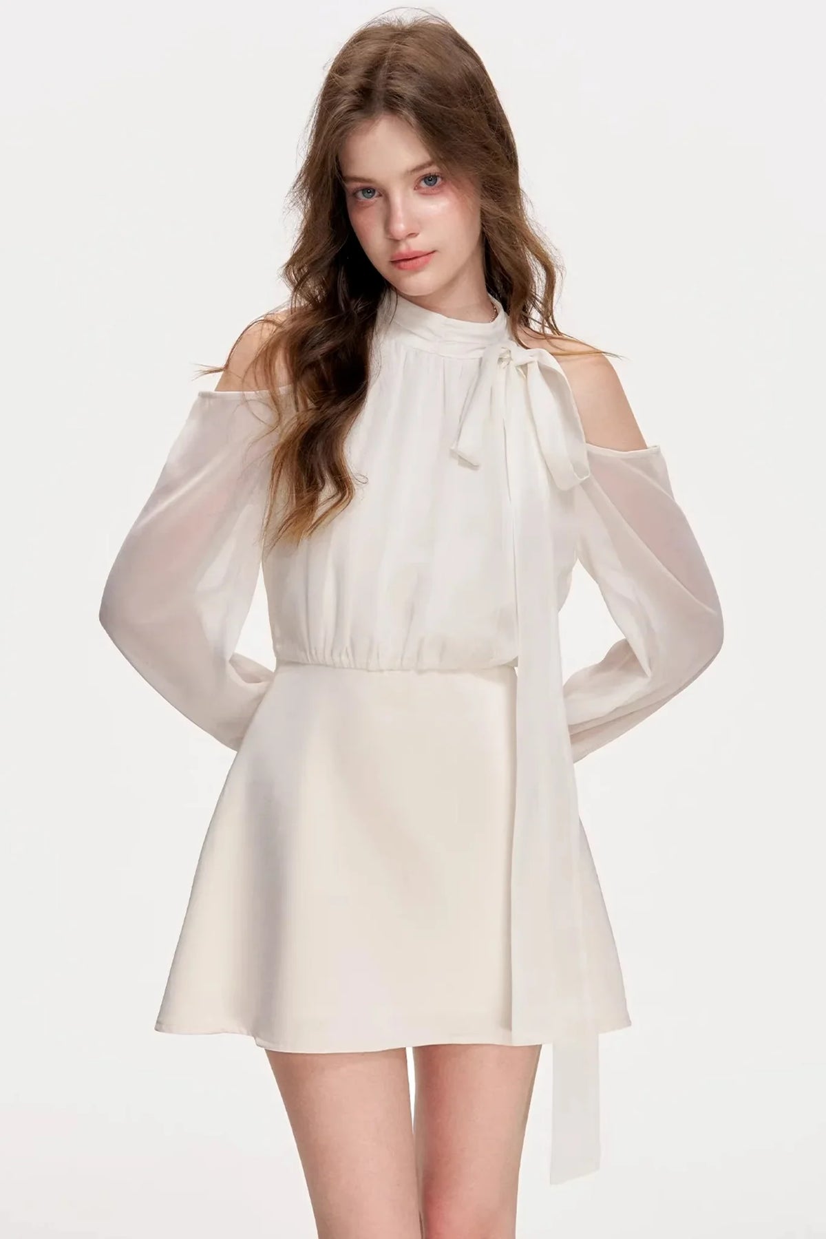 A white satin off-shoulder A-line dress with long sleeves.