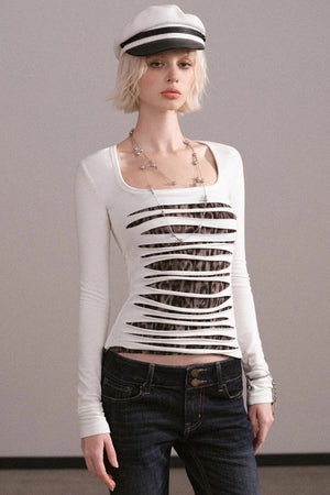 A white long-sleeve top with a unique ripped design and square neckline.