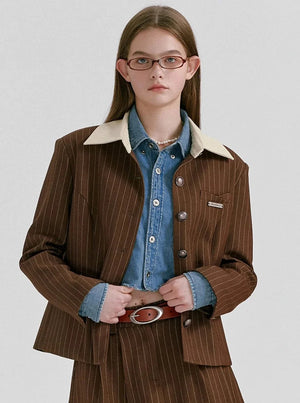 A brown pinstriped jacket with a cream-colored collar.