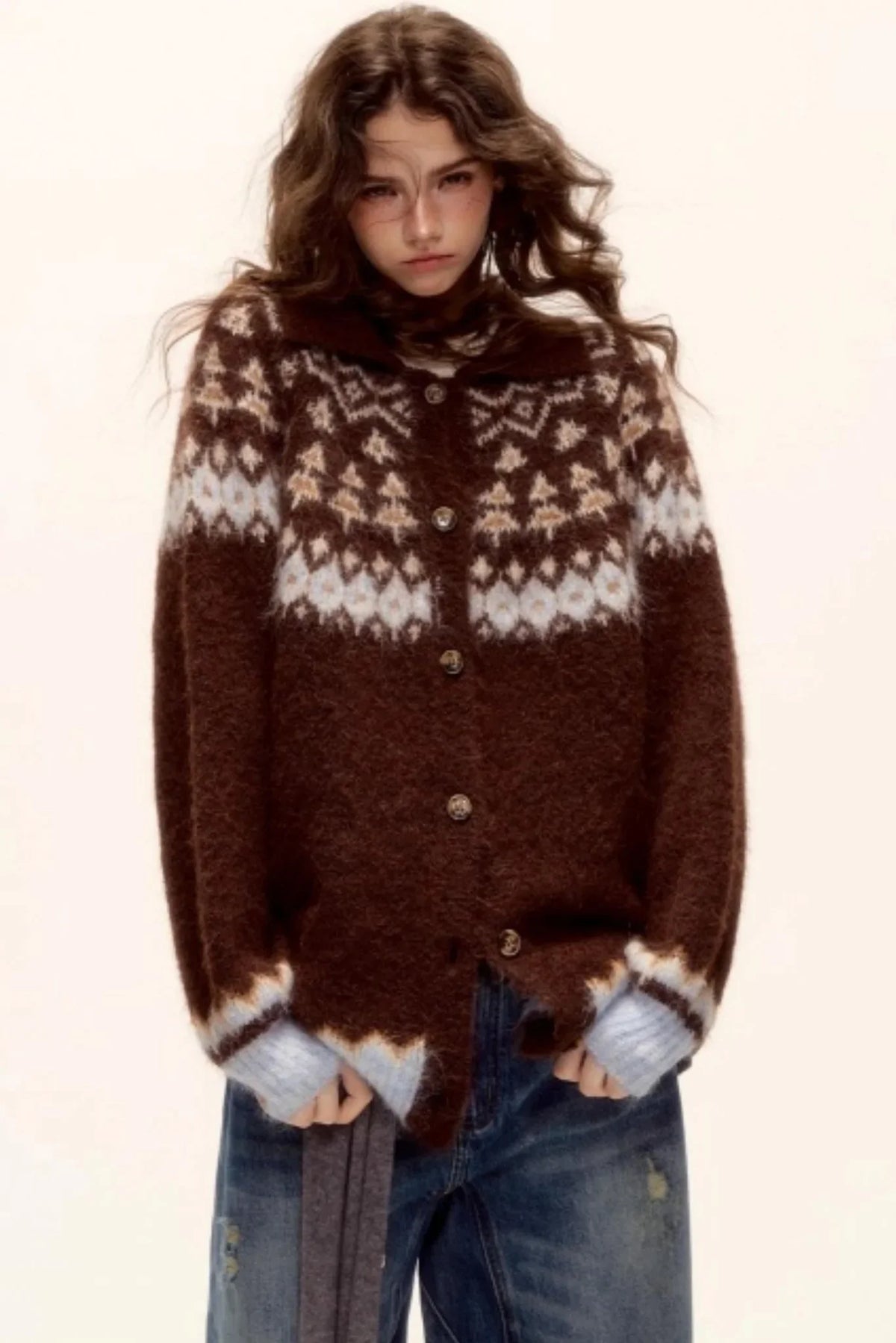 A model wearing a brown Fair Isle wool cardigan.