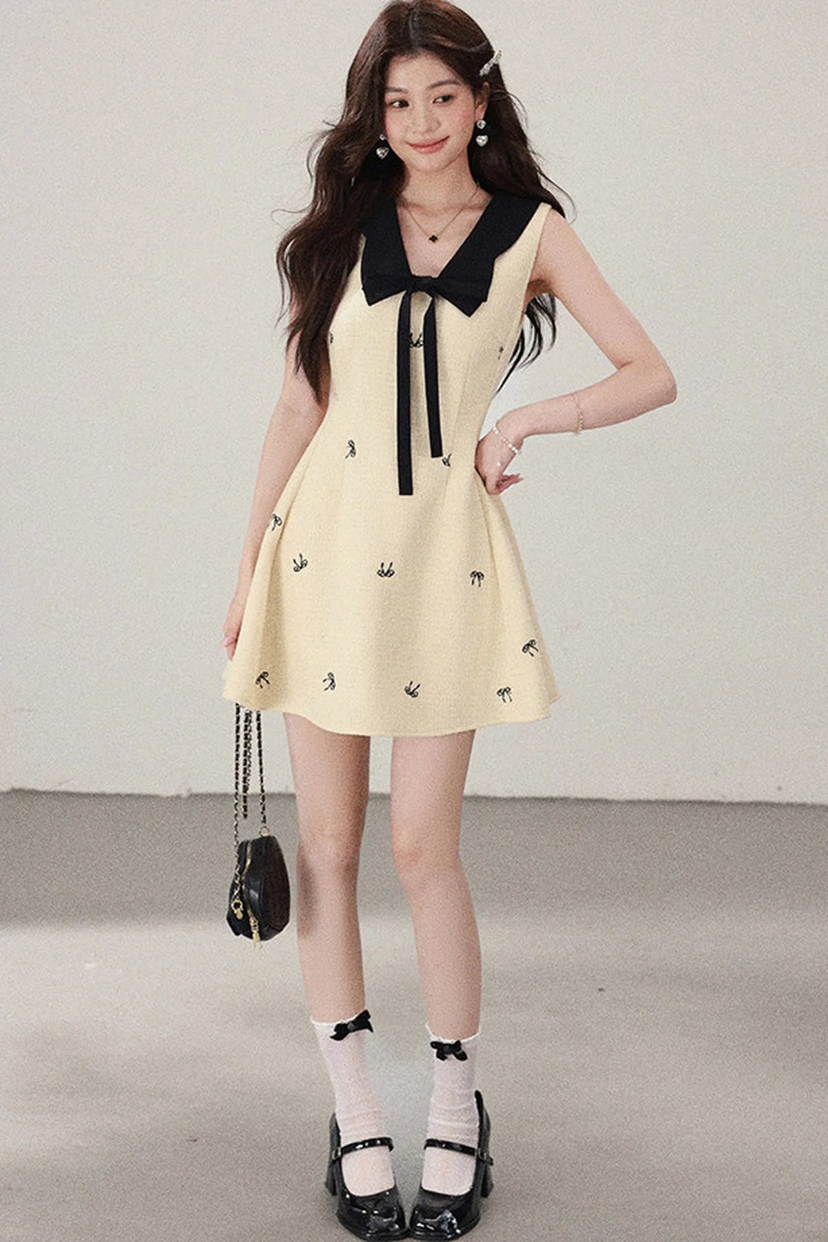 Yellow Sleeveless Bow Collar Dress